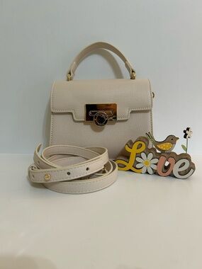 Ted Baker Cream Top-Handle Crossbody Bag With Gold Accents.